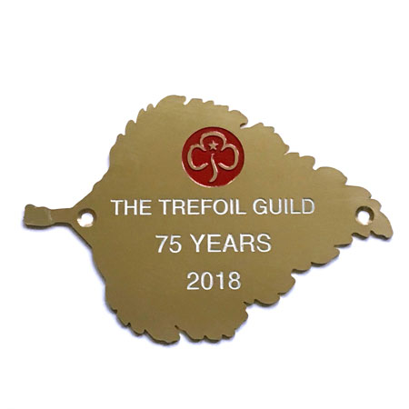 Trefoild Guild engraved on a brass birch leaf plaque